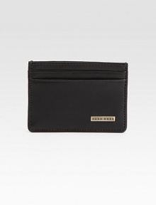 A polished card case in smooth leather with front logo plaque detail.Two card slotsOne ID window slotLeather4W x 3HImported A polished card case in smooth leather with front logo plaque detail.Two card slotsOne ID window slotLeather4W x 3HImported