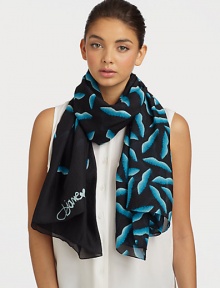 A smooth silk style that features a graphic, abstract lip print. SilkAbout 40 X 67Dry cleanImported A smooth silk style that features a graphic, abstract lip print. SilkAbout 40 X 67Dry cleanImported