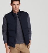This puffer vest adds a layer of eye-catching texture and warmth to your ensemble - pair it with jeans and long-sleeve shirt.