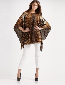 Luxuriously soft cashmere/virgin wool woven in an exotic leopard print with baby fringe trim.Pullover About 55 x 70¾ 52% cashmere/48% virgin wool Dry clean Made in Italy Luxuriously soft cashmere/virgin wool woven in an exotic leopard print with baby fringe trim.Pullover About 55 x 70¾ 52% cashmere/48% virgin wool Dry clean Made in Italy
