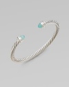 From the Cable Collection. A signature cable design with pretty aqua chalcedony caps accented in sparkling diamonds. Aqua chalcedonyDiamonds, .2 tcwSterling silverDiameter, about 2½Slip-on styleImported 