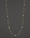 Freshwater pearls add rich luster to links of 14K yellow gold. By Nancy B.