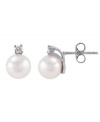 Crafted on the island of Mallorca, Spain, these lustrous man-made pearls (8 mm) shimmer with the addition of round-cut cubic zirconia accents. Stud earrings by Majorica set in sterling silver.