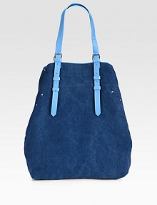 A casually chic style in denim-inspired canvas with luxurious leather trim.Adjustable shoulder straps, 2-14 dropSnap button strap closureOne inside open pocketOne detachable flashlight12W X 15H X 4DMade in Italy A casually chic style in denim-inspired canvas with luxurious leather trim.Adjustable shoulder straps, 2-14 dropSnap button strap closureOne inside open pocketOne detachable flashlight12W X 15H X 4DMade in Italy
