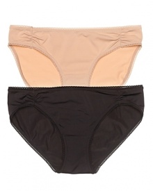 A luxuriously soft bikini with ruching at hips and scalloped edge trim. A luxuriously soft bikini with ruching at hips and scalloped edge trim.