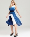 Intricately pleated, this showstopping BCBGMAXAZRIA dress perfects the color-block trend in rich blue hues.