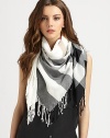 This lightweight style boasts an iconic print and all-around fringe details. CottonAbout 43¼ X 47¼Dry cleanImported 