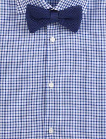 A waffle-textured silk weave in a simple, solid color bow tie.SilkDry cleanMade in Italy A waffle-textured silk weave in a simple, solid color bow tie.SilkDry cleanMade in Italy