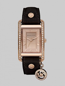 A glamorous, chic design with a chocolate brown leather strap and sparkling Swarovski crystals.Quartz movement Water resistant to 5 ATM Rose goldplated stainless steel rectangular case, 32mm x 36mm, (1.25 x 1.02) Swarovski crystals along side case Light rose gold dial Arabic numeral and index hour markers Second hand Swarovski crystal logo charm Leather strap Buckle closure Imported 