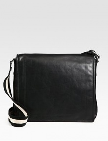 Simple, sleek design in calfskin leather is completed with a full flap closure and iconic trainspotting web shoulder strap detail.Flap closureAdjustable shoulder strapInterior pocketsFully lined15W x 13H x 4DMade in Switzerland Simple, sleek design in calfskin leather is completed with a full flap closure and iconic trainspotting web shoulder strap detail.Flap closureAdjustable shoulder strapInterior pocketsFully lined15W x 13H x 4DMade in Switzerland