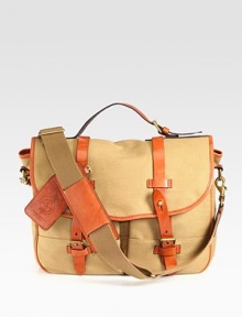 The iconic messenger bag is granted laid-back luxury from a burnished saddle-leather double-buckle closure and an embossed signature leather luggage tag for a sharp finish.Flap closureTop handleAdjustable, removable shoulder strapExterior slip, patch pocketsInterior zip pocketEmbossed signature leather luggage tagAccented with antiqued brass hardware and burnished leather trim.Canvas15W x 12H x 5DImported The iconic messenger bag is granted laid-back luxury from a burnished saddle-leather double-buckle closure and an embossed signature leather luggage tag for a sharp finish.Flap closureTop handleAdjustable, removable shoulder strapExterior slip, patch pocketsInterior zip pocketEmbossed signature leather luggage tagAccented with antiqued brass hardware and burnished leather trim.Canvas15W x 12H x 5DImported