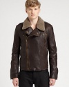 An asymmetrical zip front sets the tone for this contemporary update to the classic leather jacket, rendered in supple Italian calfskin leather with a shearling collar for the ultimate experience of luxury and warmth.Two-way zip frontShoulder epaulettesZippered chest, waist slash pocketsAbout 24 from shoulder to hem54% cotton/23% virgin wool/23% acrylicDry cleanMade in ItalyFur origin: SpainThis style runs small. 