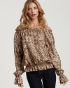 Bohemia meets luxury with this Rachel Zoe peasant top, rendered in a fierce leopard print on a romantic off-the-shoulder silhouette.