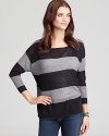 A fresh crop from Joie, this striped sweater in rendered in a boxy silhouette and boasts a chic boat neck for a nautical fall look.