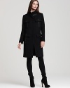 Supple leather trim accents this military-inspired DKNY coat for an edgy, cosmopolitan finish.