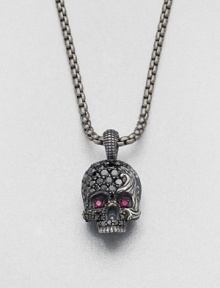 Eye-catching rubies and black diamonds embellish this edgy skull design of sterling silver, suspended from a link chain.Sterling silver/titaniumBlack diamond/rubyAbout 9 diam.Imported Eye-catching rubies and black diamonds embellish this edgy skull design of sterling silver, suspended from a link chain.Sterling silver/titaniumBlack diamond/rubyAbout 9 diam.Imported