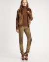 Stay warm and chic in this cabled design accented with natural shearling. Stand collarLong cabled sleevesFront zip closure Front slash pocketsAbout 24 from shoulder to hem90% merino wool/10% angoraDry cleanImported Fur origin: Italy Model shown is 5'7½ (171cm) wearing US size Small.