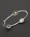 Faceted pyrite doubles dot a sterling silver bangle from Ippolita.