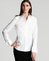 Elie Tahari lends timeless perfection to workday wares in this crisp white blouse. Pair with everything from high-waisted skirts to sleek trousers for a classy finish.