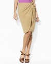 An elegant blend of urban-chic style and rustic heritage, this Lauren By Ralph Lauren skirt is crafted from soft, sumptuous Italian goat suede in a modern faux-wrap silhouette.