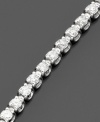 Elegant round-cut diamonds (2 ct. t.w.) are perfectly arranged in this stunning tennis bracelet set in 14k white gold. 2 carat diamond bracelet approximate length: 7-1/4 inches.