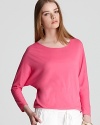 Pop with personality in a hot pink Vince tee, emboldened with dolman sleeves and a sheer texture for a modern take on the classic go-with-all style.