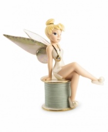 Disney's Tinkerbell sits primly atop a spool of thread in this vividly detailed porcelain figurine by Lenox. Accented with 24-karat gold. Disney's Tinkerbell sits primly atop a spool of thread in this vividly detailed porcelain figurine by Lenox. Accented with 24-karat gold.