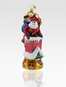 Inspired by the famous Christmas song, a fancily decorated Santa carefully makes his way down the chimney with a bag full of toys. Hand-blownHand-painted7½ highMade in Poland Inspired by the famous Christmas song, a fancily decorated Santa carefully makes his way down the chimney with a bag full of toys. Hand-blownHand-painted7½ highMade in Poland