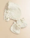An adorable bonnet-and-bootie set is rendered in soft cable-knit cotton.Adjustable buttoned chin strapAdjustable booties with cordCottonMachine washImported