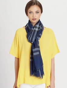 A giant check design with a fringe trim.51% wool/49% silk28 X 87Dry cleanMade in Italy