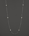 This sterling silver necklace, gleaming with freshwater pearls, makes an elegant statement. By Di MODOLO.