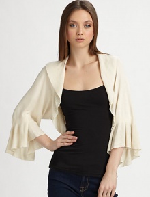 This soft knit style is finished with a delicately ribbed shawl collar and matching flutter cuffs.Rib-knit shawl collarThree-quarter sleeves with rib-knit flutter cuffsAbout 12 from shoulder to hem80% rayon/20% nylonImportedDry clean This soft knit style is finished with a delicately ribbed shawl collar and matching flutter cuffs.Rib-knit shawl collarThree-quarter sleeves with rib-knit flutter cuffsAbout 12 from shoulder to hem80% rayon/20% nylonImportedDry clean