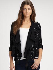 The perfect cover-up in comfortable cotton and sparkling sequins with a fly-away, open front. Banded open necklineThree-quarter length sleevesDraped, open frontAsymmetrical hemSilk linedAbout 22 from shoulder to hem90% cotton/10% spandexHand washImported The perfect cover-up in comfortable cotton and sparkling sequins with a fly-away, open front. Banded open necklineThree-quarter length sleevesDraped, open frontAsymmetrical hemSilk linedAbout 22 from shoulder to hem90% cotton/10% spandexHand washImported