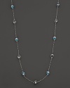 This bold sterling silver lstation necklace gleaming with blue quartz, is a brilliant showcase for Di MODOLO's iconic Triadra design.