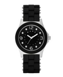 Wear it sporty or wear it stylishly: the Pelly watch by Marc by Marc Jacobs. Black silicone-wrapped stainless steel bracelet and round stainless steel case. Bezel with black silicone ring. Black dial features applied silvertone numerals at twelve, three, six and nine o'clock, dot markers, three silvertone hands and logo ring at inner dial. Quartz movement. Water resistant to 30 meters. Two-year limited warranty.