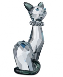 Ines, Swarovski's high-fashion feline, sits tall and proud in faceted shadow crystal. A string of gray pearls and contrasting ears and tail emphasize her slender physique and ladylike pose. Ines, Swarovski's high-fashion feline, sits tall and proud in faceted shadow crystal. A string of gray pearls and contrasting ears and tail emphasize her slender physique and ladylike pose.