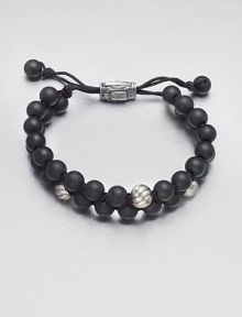 Smooth and polished beaded bracelet of black onyx and sterling silver with logo-engraved clasp.Black onyxSterling silverAdjustable claspAbout 2½ diam.Imported Smooth and polished beaded bracelet of black onyx and sterling silver with logo-engraved clasp.Black onyxSterling silverAdjustable claspAbout 2½ diam.Imported