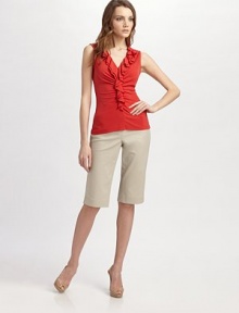 A flirty tiered ruffle neckline adds intrigue to this indulgently soft silk design. V-neck Sleeveless Tiered ruffle detail About 24½ from shoulder to hem Silk Dry clean Imported A flirty tiered ruffle neckline adds intrigue to this indulgently soft silk design. V-neck Sleeveless Tiered ruffle detail About 24½ from shoulder to hem Silk Dry clean Imported