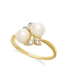 A natural choice. This ring, crafted from 10k gold, exudes elegance with cultured freshwater pearls and diamond accents along a whimsical leaf motif. Approximate size: 3/4 inch. A natural choice. This ring, crafted from 10k gold, exudes elegance with cultured freshwater pearls and diamond accents along a whimsical leaf motif. Approximate size: 3/4 inch.