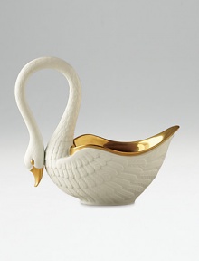 This graceful swan in white porcelain and 14kt gold accents is perfect for serving or decoration. Hand-gilded 7 edition: 3W X 7H X 6½D 13 edition: 6W X 13H X 13D Made in Portugal This graceful swan in white porcelain and 14kt gold accents is perfect for serving or decoration. Hand-gilded 7 edition: 3W X 7H X 6½D 13 edition: 6W X 13H X 13D Made in Portugal