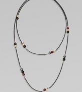 From the Black and Gold Chain Collection. A dramatically, long blackened sterling silver box chain with 18k gold, black onyx, hematite and garnet bead stations in various sizes; perfect for wearing doubled. Blackened sterling silver18k gold, black onyx, hematite and garnet beadsLength, about 40Lobster clasp closureImported 