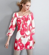 Add this petite Alfani tunic to your spring wardrobe--the print pops with bright color and the crochet detail at the sleeves is the perfect finishing touch.
