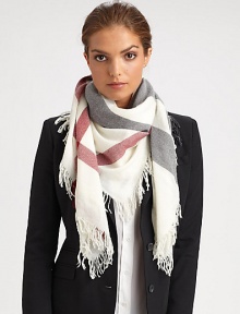 A vibrant check design is printed on this plush wool scarf with allover fringe trim.Wool43 X 43Dry cleanImported