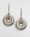 Ornately textured donuts of sterling silver are sparked with accents of 18k yellow gold. Sterling silver and 18k yellow gold Drop, about ½ Ear wire Made in USA