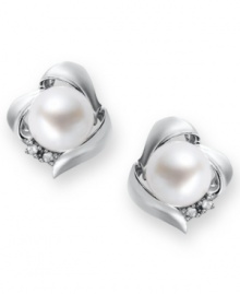 A simple, sophisticated touch. These petite knot-shaped stud earrings feature a cultured freshwater pearl (7 mm) and sparkling diamond accents at the sides. Set in sterling silver. Approximate diameter: 3/8 inch. A simple, sophisticated touch. These petite knot-shaped stud earrings feature a cultured freshwater pearl (7 mm) and sparkling diamond accents at the sides. Set in sterling silver. Approximate diameter: 3/8 inch.