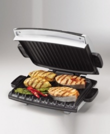 Get barbeque-style hot dogs or veggie burgers right in your kitchen with his new option from the George Foreman Grill line. It's large, 96-square-inch grill surface has room for multiple items at once and improved heat distribution. Other features include an oversize LED readout for variable temperature control and timer for cooking accuracy, a 1-inch floating hinge, a classic drip tray, a utensil that's gentle on the grill surface, and a silver metallic finish. Model GRP99. Get barbeque-style hot dogs or veggie burgers right in your kitchen with his new option from the George Foreman Grill line. It's large, 96-square-inch grill surface has room for multiple items at once and improved heat distribution. Other features include an oversize LED readout for variable temperature control and timer for cooking accuracy, a 1-inch floating hinge, a classic drip tray, a utensil that's gentle on the grill surface, and a silver metallic finish. Model GRP99.
