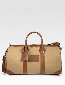 Prepare for your next weekend adventure with this lightweight, roomy classic duffel of cotton canvas trimmed in smooth leather.Zip closureTop handlesRemovable shoulder strapInterior zip pocketCanvas19W x 11H x 10DImported Prepare for your next weekend adventure with this lightweight, roomy classic duffel of cotton canvas trimmed in smooth leather.Zip closureTop handlesRemovable shoulder strapInterior zip pocketCanvas19W x 11H x 10DImported