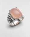 From the Wheaton Collection. A faceted cushion of milky pink opal, edged by rows of diamonds, in a wide cable band of sterling silver.Diamonds, 0.16 tcw Pink opal Sterling silver Width, about ½ Imported