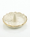 A single rose blossom and delicate dots carved in ivory porcelain make this classic ring holder a fine storage space for special jewelry. With a scalloped, gold-tipped rim. Qualifies for Rebate