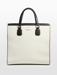 Canvas tote with leather trim.Double handlesDark palladium hardwareInterior zip, cell phone and PDA pocketCotton/linen lining17W x 16H x 7D Made in Italy Canvas tote with leather trim.Double handlesDark palladium hardwareInterior zip, cell phone and PDA pocketCotton/linen lining17W x 16H x 7D Made in Italy